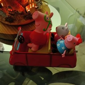 Peppa pig red car and 3 figures as shown. Characters do not fit exactly sitting.